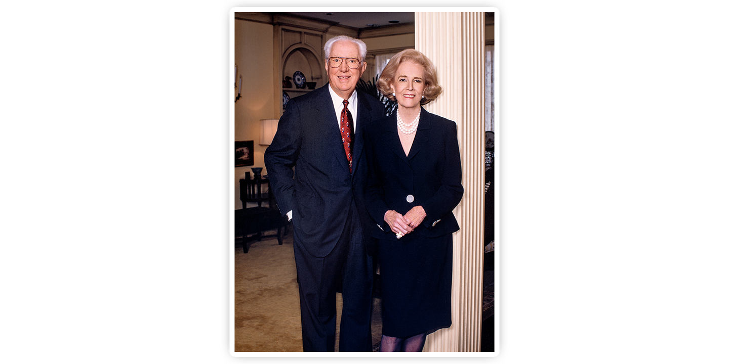 A photo of John S. Justin, Jr. and Jane Justin posting near a pillar.